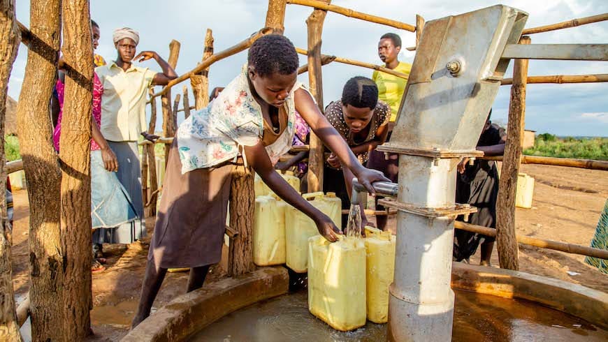 Women getting water from a pump